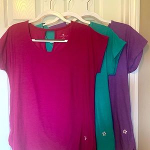 Women’s size M workout tops - pretty jewel colors. Fit and hang nicely